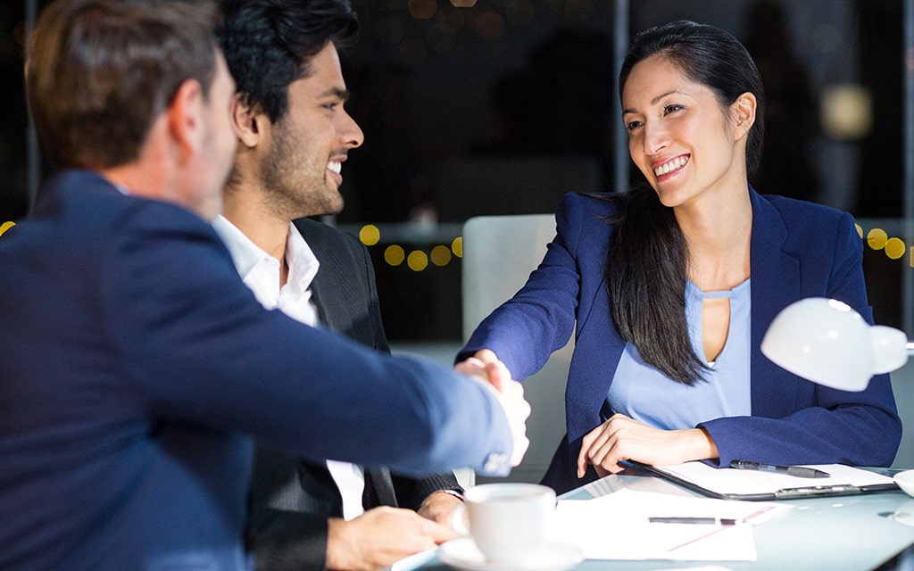 businessman-shaking-hands-covered-min